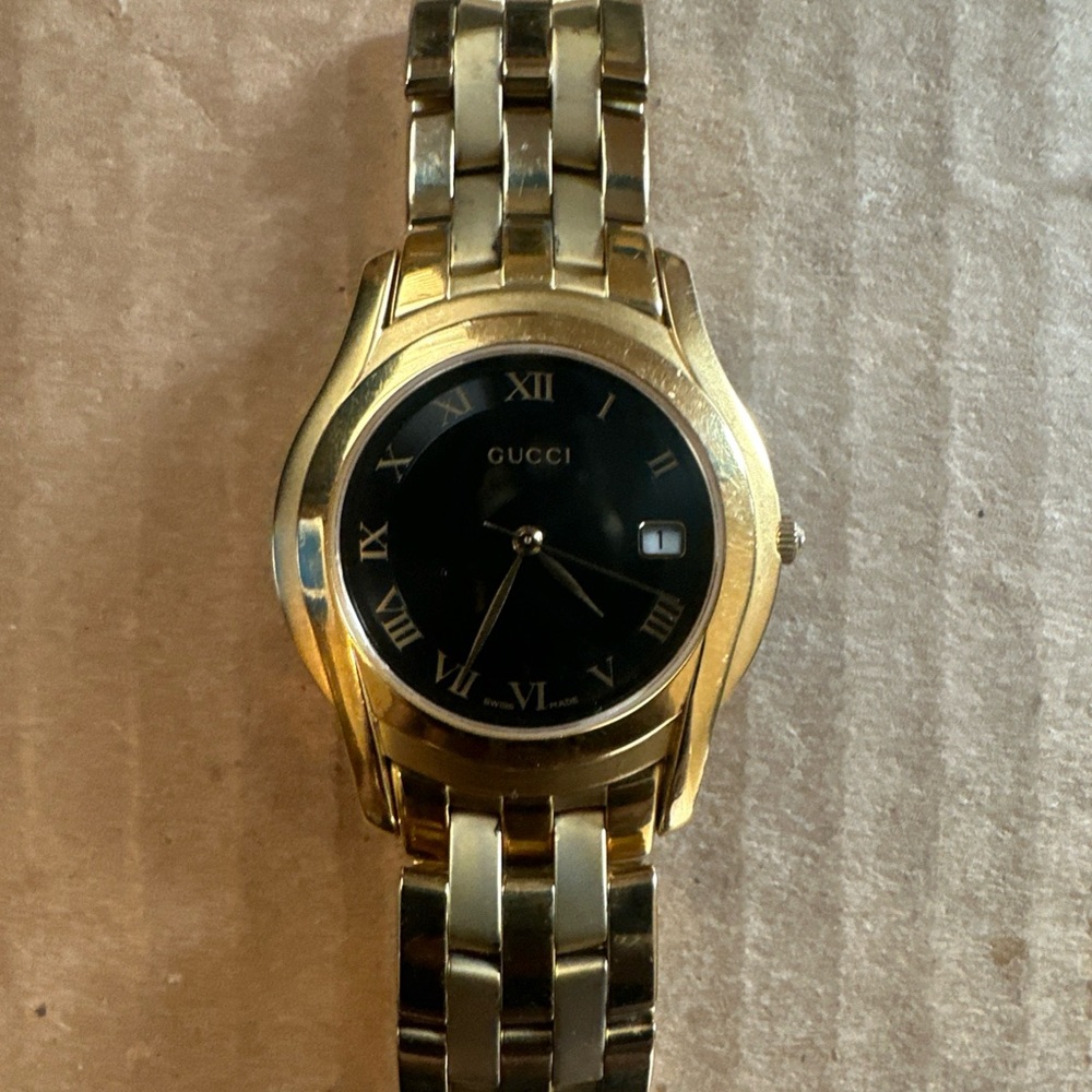 Gucci Gold and Black Luxury Watch with Date Window